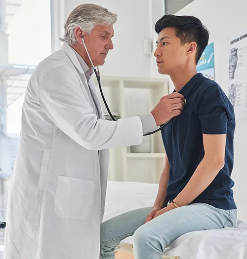 A cardiac healthcare professional monitoring a patient for cerebrovascular diseases and symptoms of stroke.