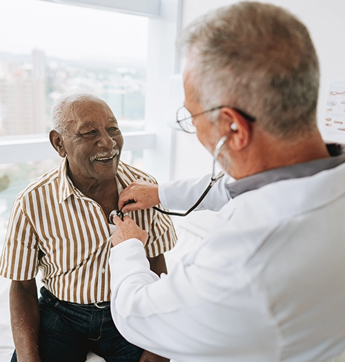 A Black elderly male patient receives a heart check-up. Learn about congestive heart failure and other health topics at SeeMedX.