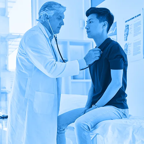 A cardiac healthcare professional monitoring a patient for cerebrovascular diseases and symptoms of stroke.